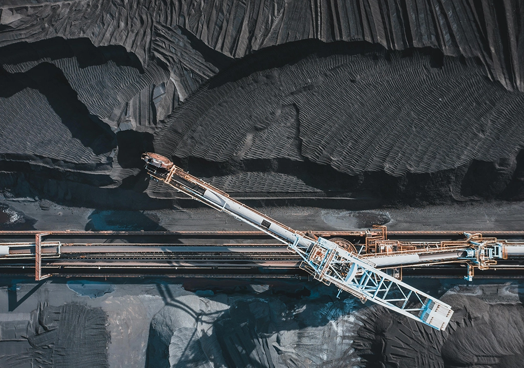 Industrial excavator on a mountain digging iron.